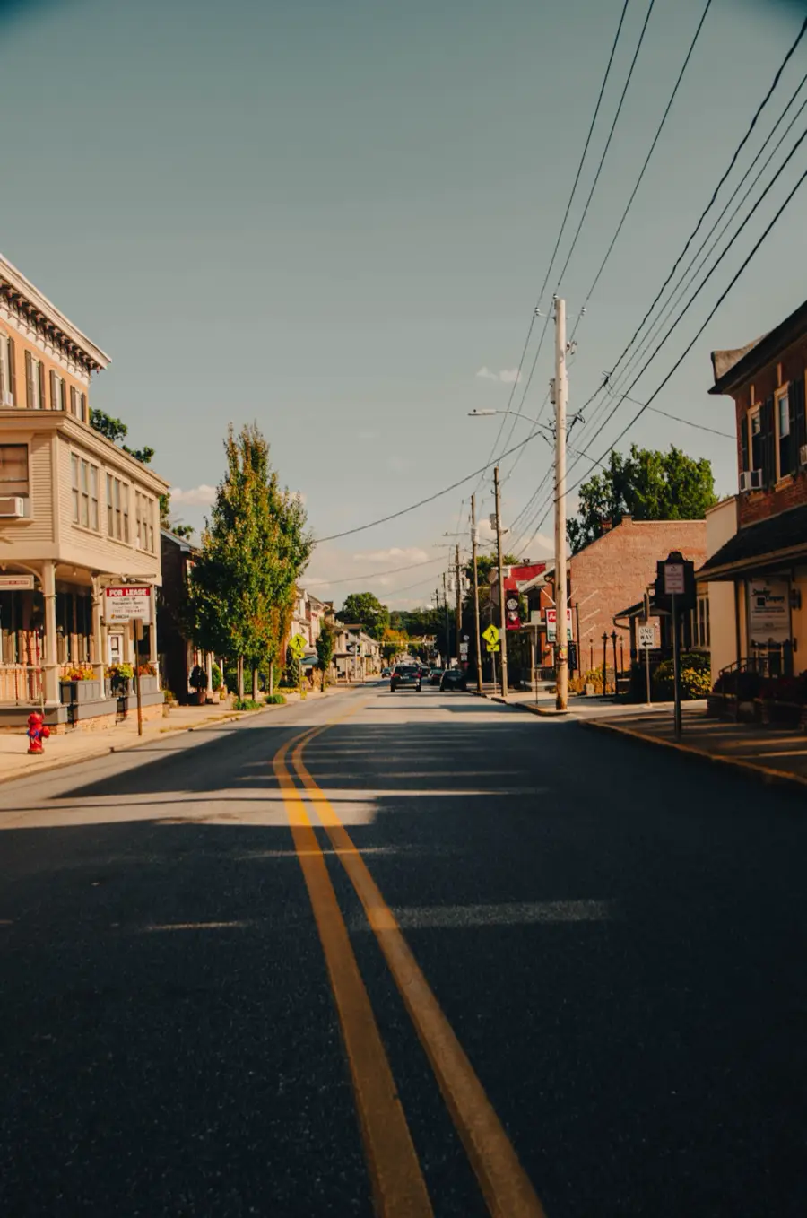 Historic small-town street lined with brick buildings