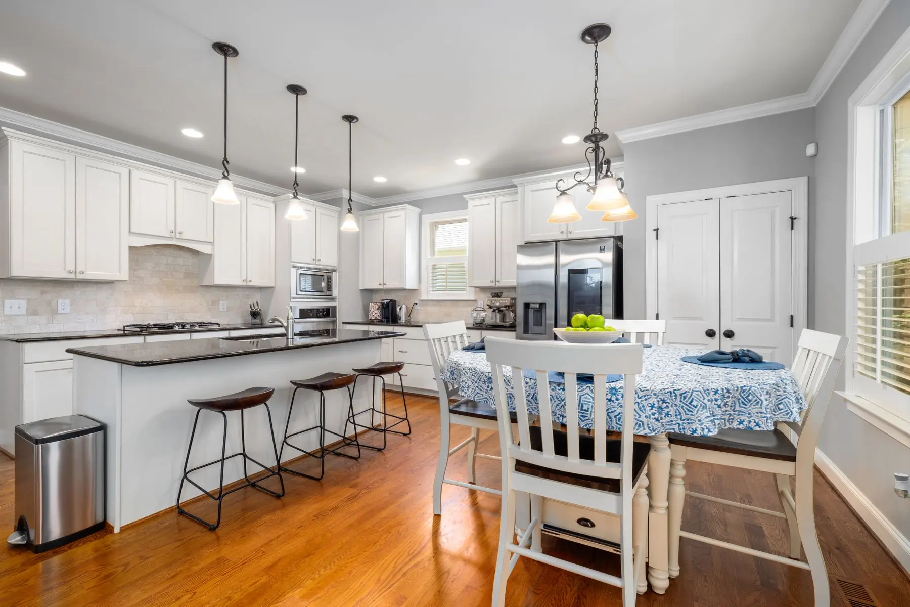 Kitchen with white cabinets and a center island