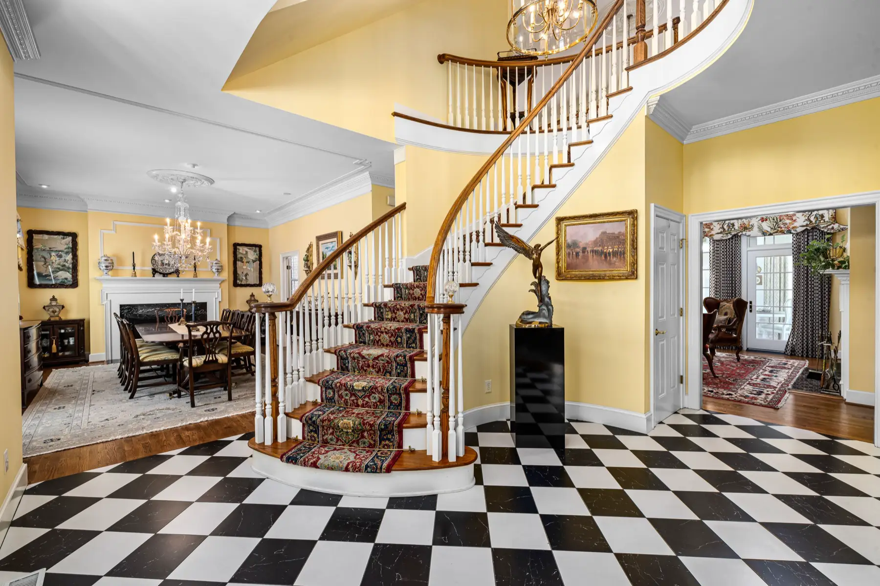Marble foyer with curved staircase